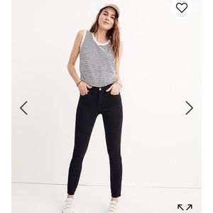 Woman’s Madewell black skinny jeans.